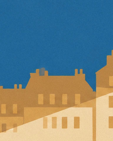 Ochre roofs and façades with small chimneys beneath a deep blue sky