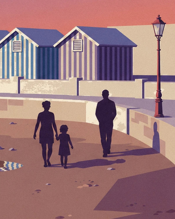 A family of 3 figures walking along the beach, beneath the red street lamp
