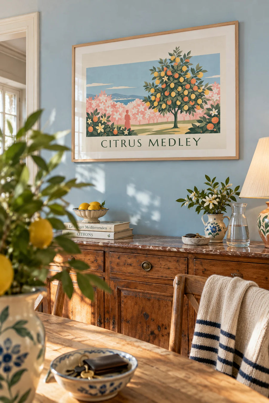 Poster of yellow lemons and oranges on a floral background: framed on the wall