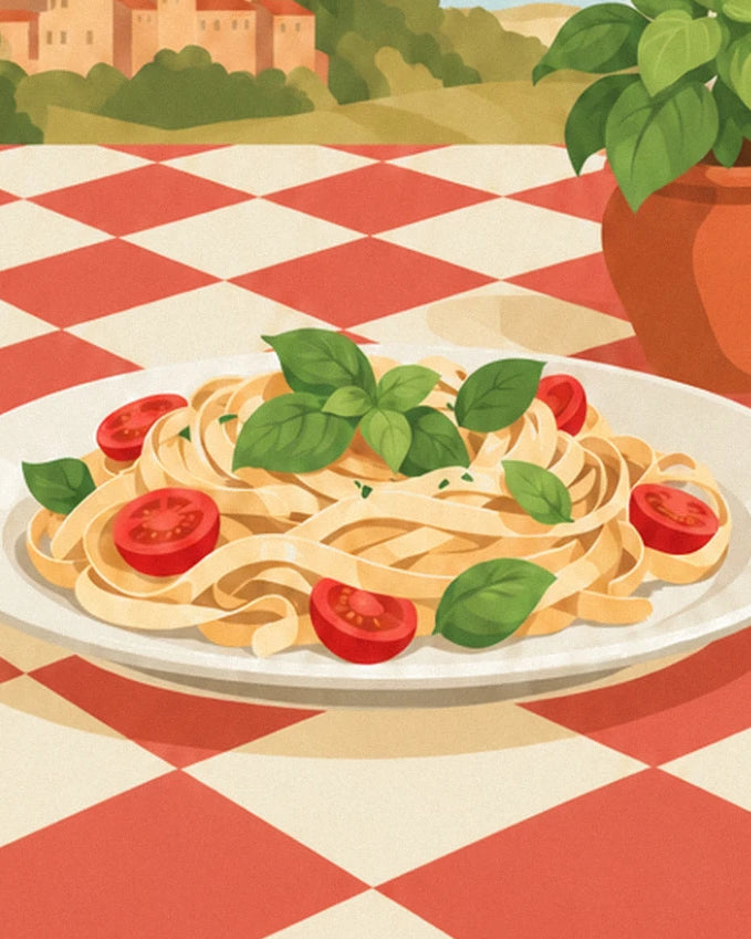 A plate of tagliatelle with basil and cherry tomatoes, on the red checked tablecloth