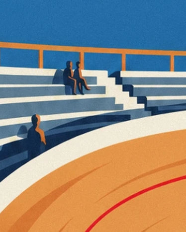 Spectators in the white and blue stands beside the wooden track