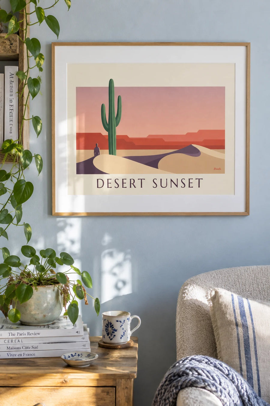 Poster of a saguaro cactus in the desert at sunset: framed on the wall