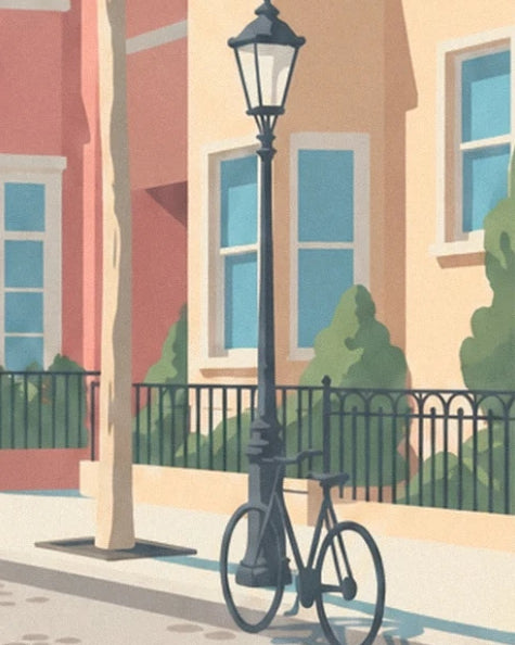 The black bicycle against the street lamp in front of small gardens edged with railings
