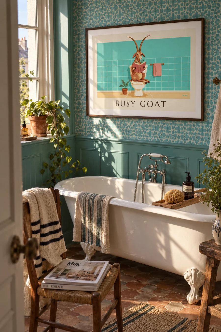 Humorous poster of a goat reading on the toilet: framed on the wall