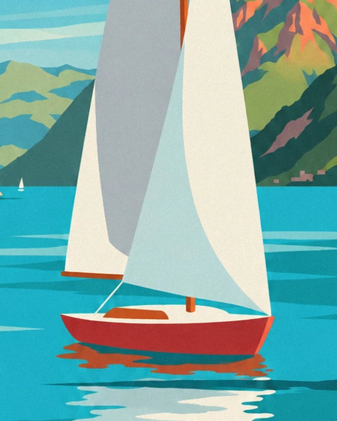 Un voilier à coque rouge et voiles blanches sur l'eau turquoise du lac d'Annecy