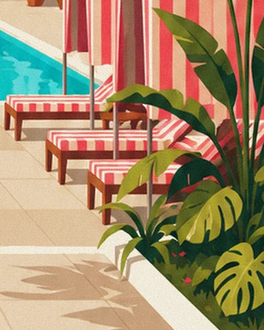 The pink and white striped sun loungers bordered by broad exotic leaves