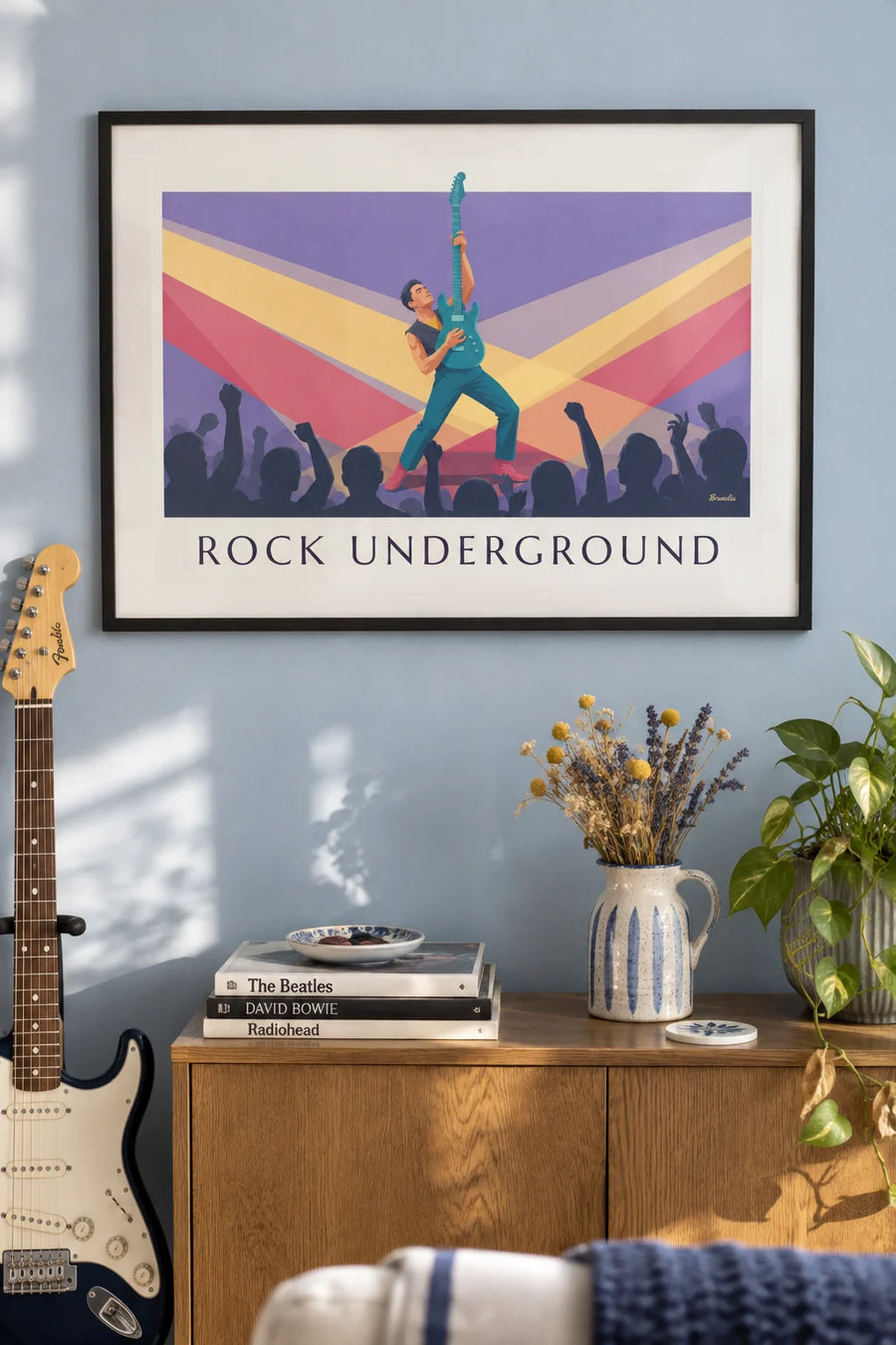 Poster of an electric guitarist in a smoky rock club: framed on the wall