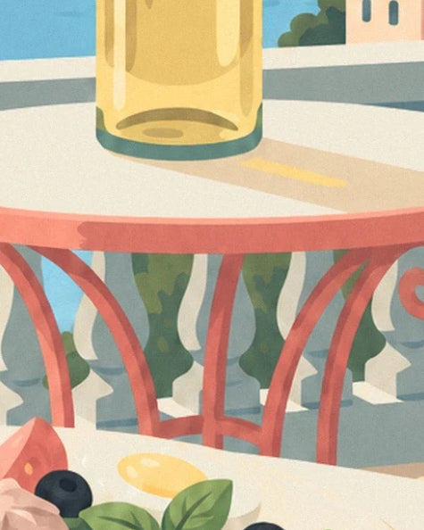 A golden glass on a cream table in front of the red chairs and balustrade