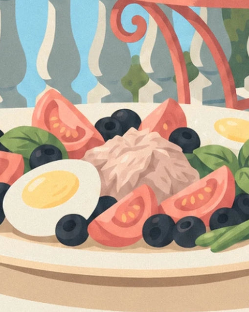 Niçoise salad with tomatoes, egg and black olives on a cream plate
