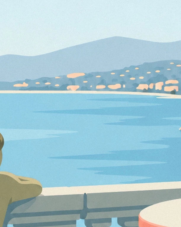 The turquoise sea bordered by pale houses and blue hills, seen from the terrace