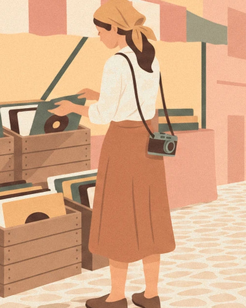 La jeune femme au foulard ocre, son appareil photo et les bacs de vinyles