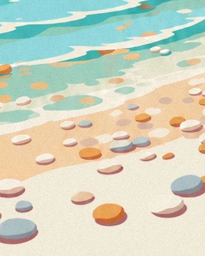 White, grey and golden pebbles on the sand beside the turquoise water