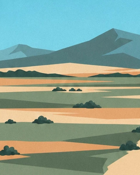 Les montagnes bleutées au-dessus des terres sableuses parsemées de buissons
