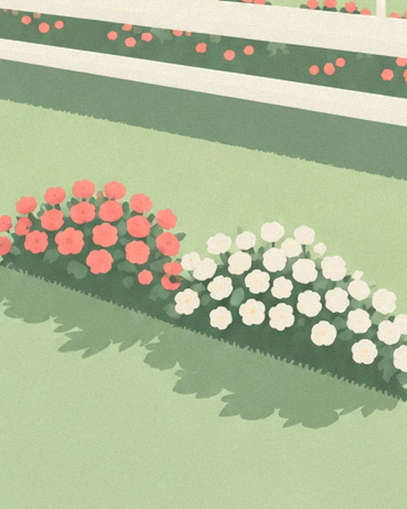 Beds of pink and white flowers along the green lawn beside the running rail