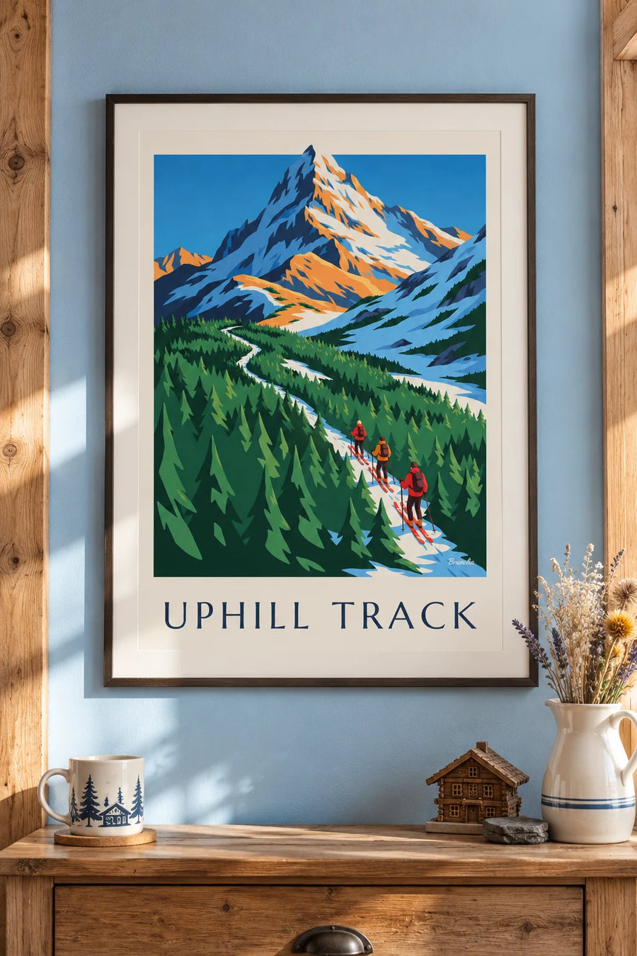 Poster of 3 ski tourers climbing through the fir trees: framed on the wall