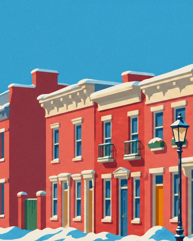 A row of red brick houses with white cornices, with a black street lamp beneath the blue sky