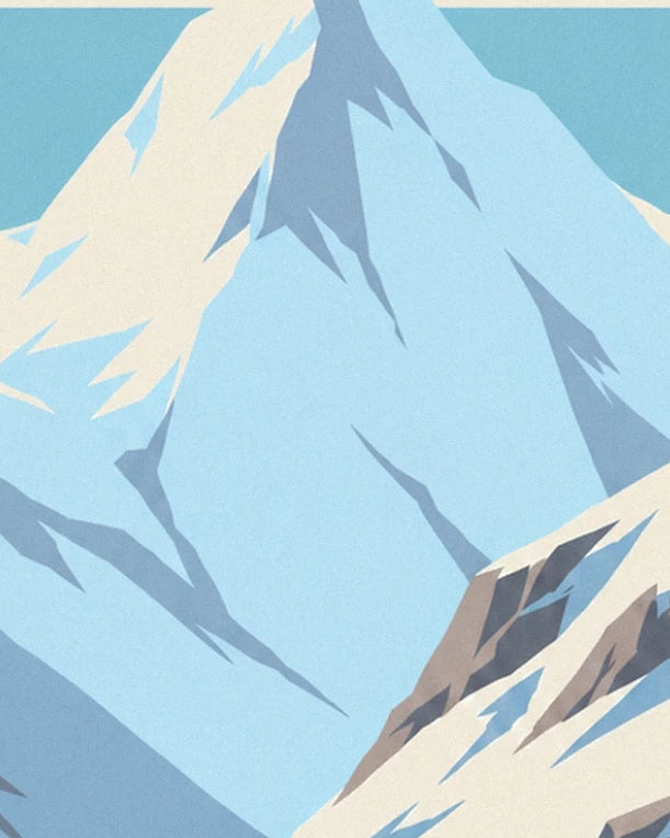 The blue-tinged mountain faces, between pale snow and angular rocks