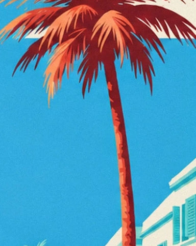 A palm tree with red and orange fronds against the blue sky and a pale façade