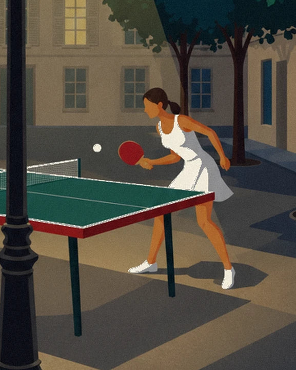 The female player in a white dress, red bat in hand, in front of the table tennis table
