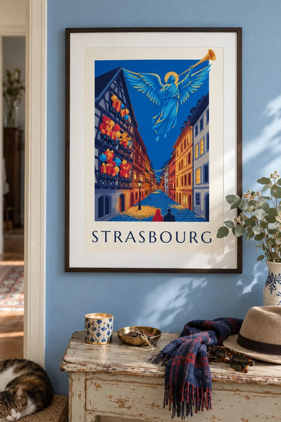 Strasbourg jouluna, valaisevan enkelin juliste : kehystettynä seinällä