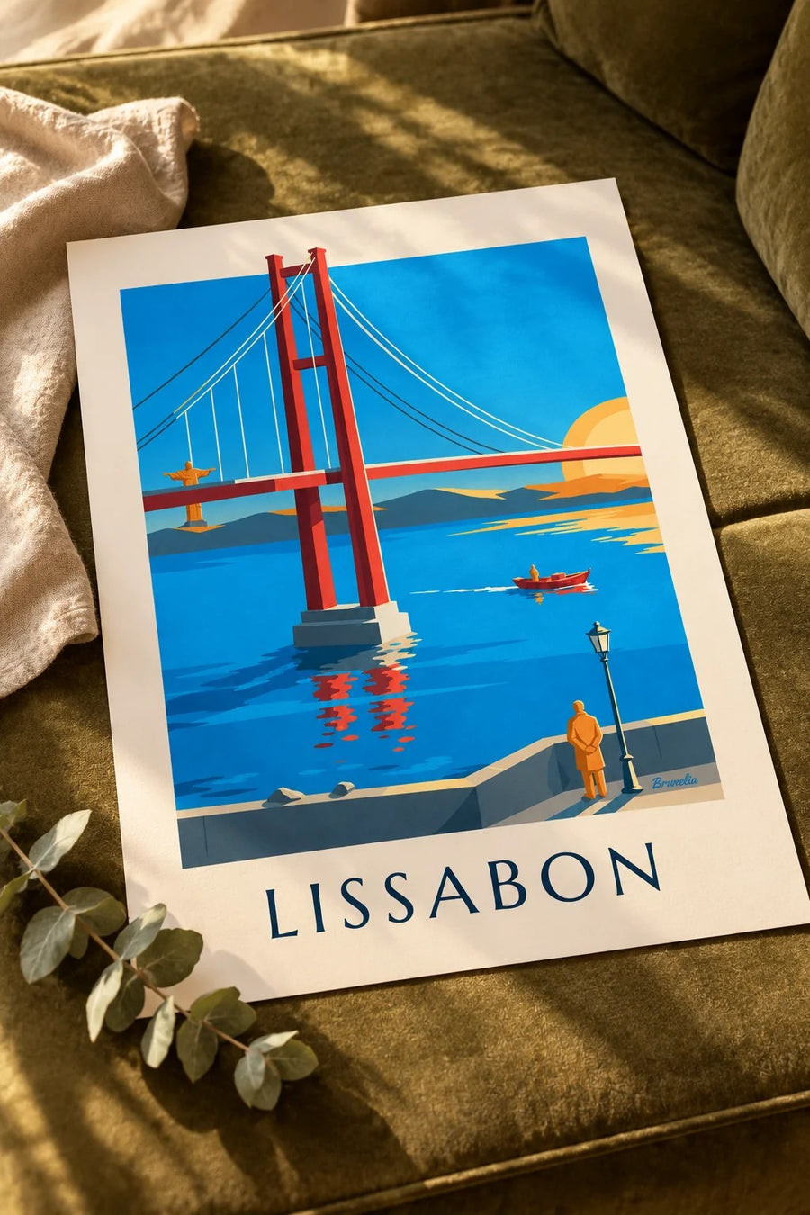 Juliste 25. huhtikuuta -silta Tejo-joella Lissabonissa: pöydällä