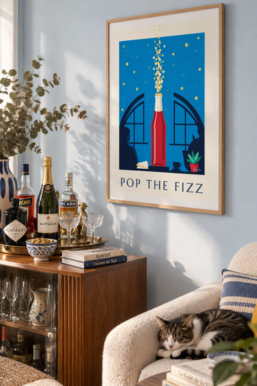 Poster of a bottle of sparkling soda under a starry sky: framed on the wall