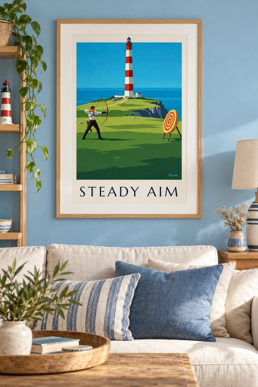 Juliste jousiampuja kalliolla meren ja majakan edessä: kehystettynä seinällä