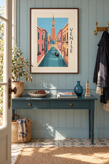 Poster of a gondolier on a small canal beneath the Campanile in Venice: framed on the wall