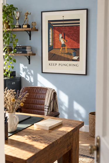 Poster of a boxer training on a punching bag in an old gym: framed on the wall